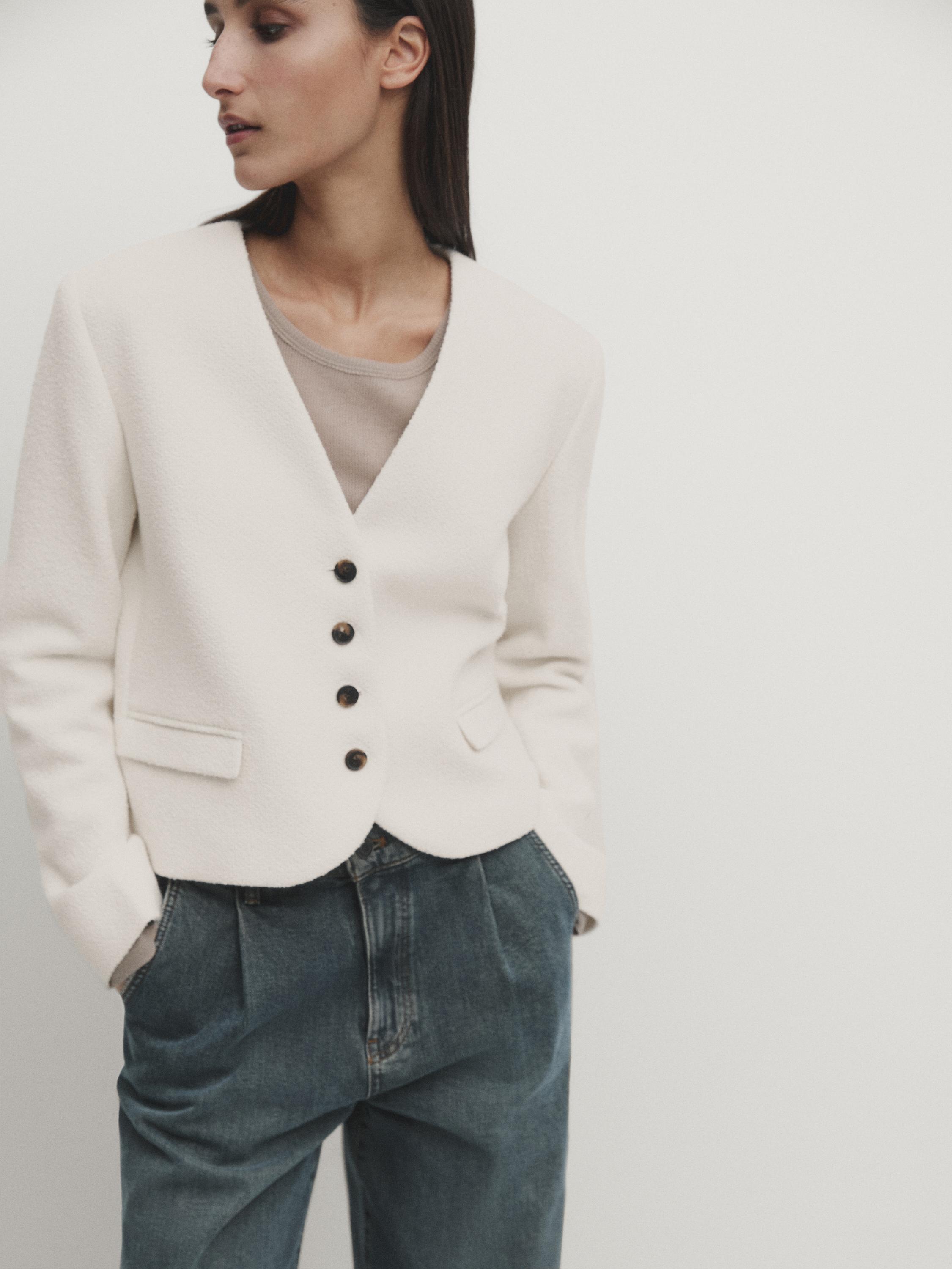 Short jacket with padded shoulders