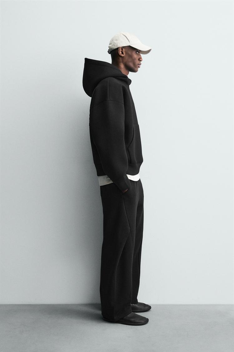 RAISED TEXT NEOPRENE EFFECT SWEATSHIRT