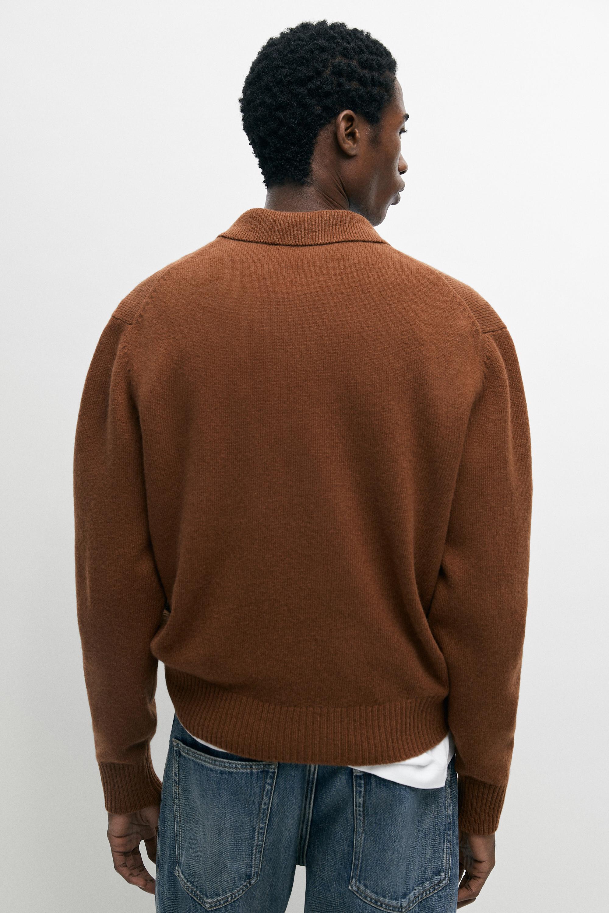 100% wool knit polo sweater with button detail