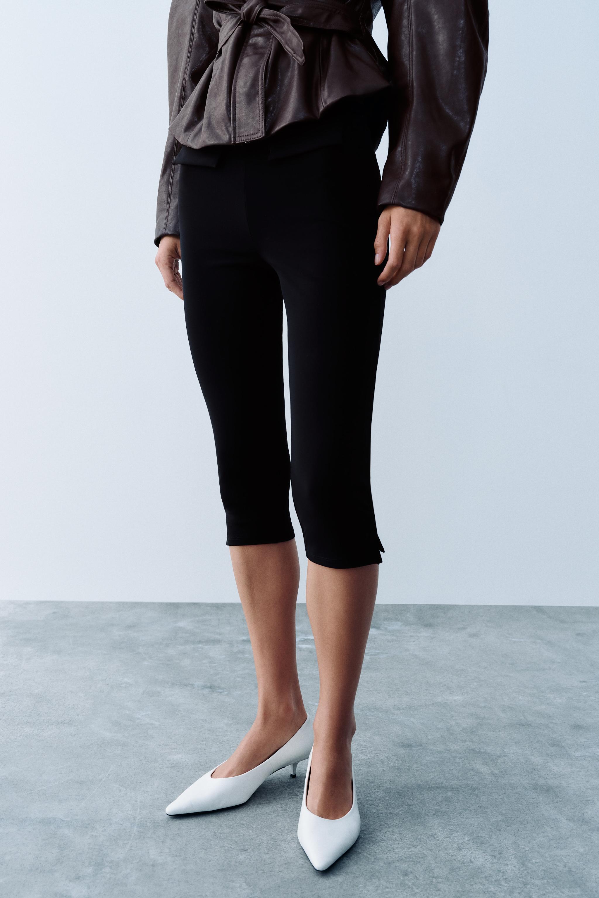 VESTE À CEINTURE EN MATIÈRE SYNTHÉTIQUE