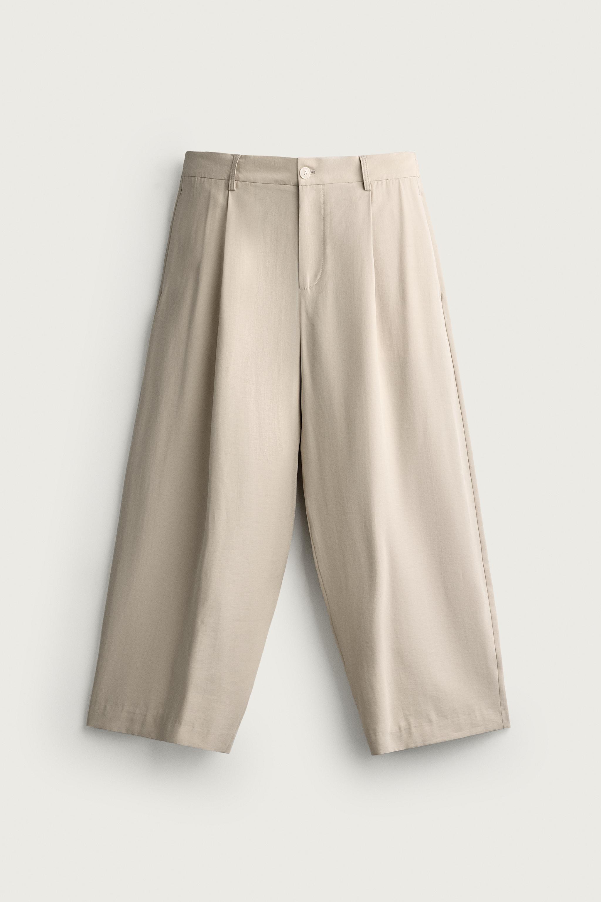 PLEATED RELAXED-FIT TROUSERS