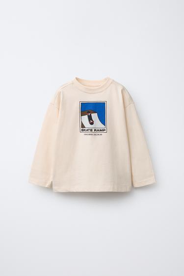 تيشرت بطبعة "SKATE" - بيج الخاص بـ Zara
