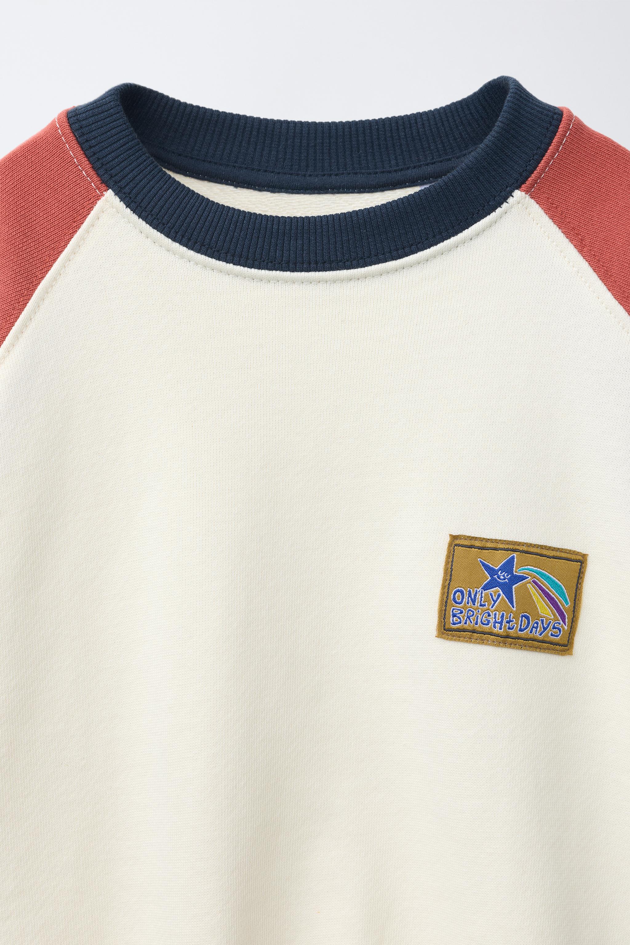 RAGLAN SLEEVE SWEATSHIRT WITH LABEL