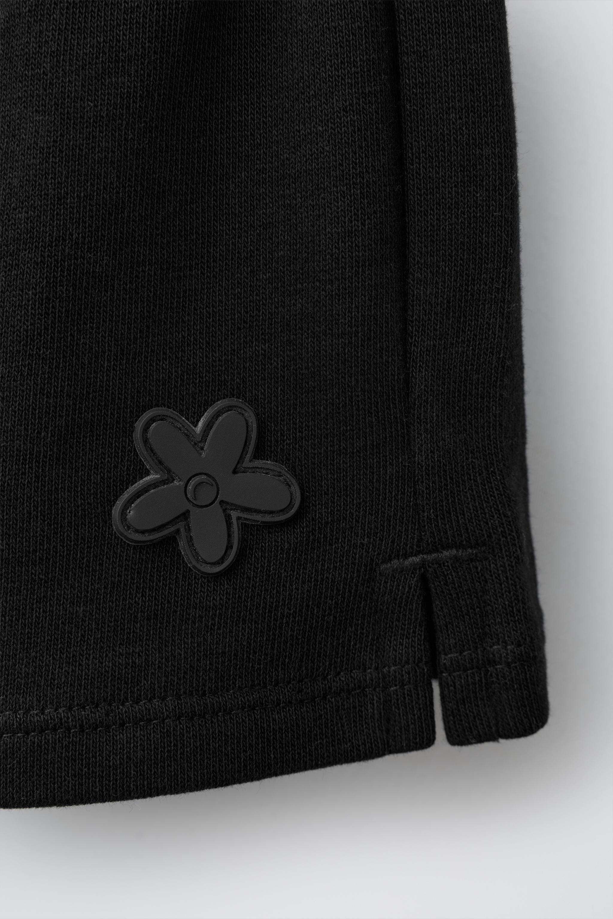 RUBBERIZED APPLIQUÉ PLUSH SHORTS