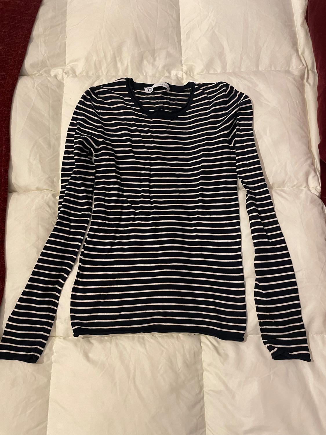KNIT SWEATER WITH ROLLING TRIMS