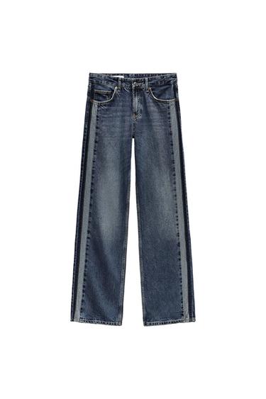 Wide-leg blue denim jeans with visible stitching and a faded effect, on a white background.