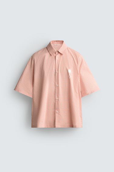 CAMISA BOXY FIT TEXTOS ESTAMPADOS - blanco-naranja de Zara