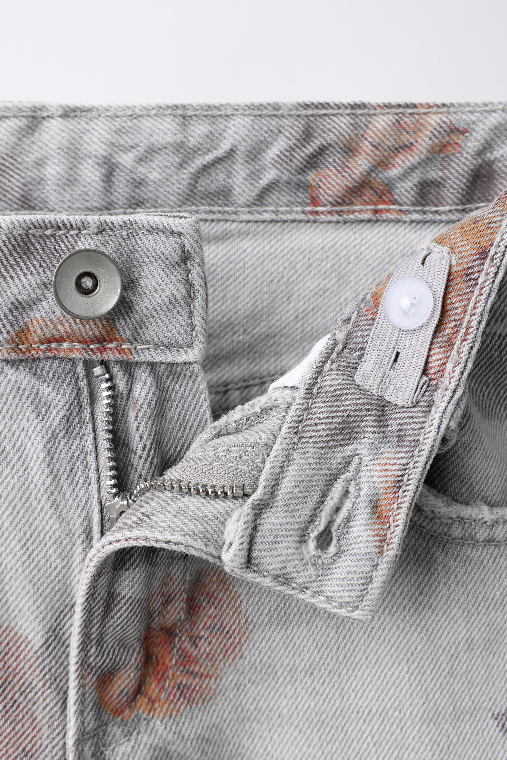 PANTALON À JAMBES LARGES IMPRIMÉ ROSES