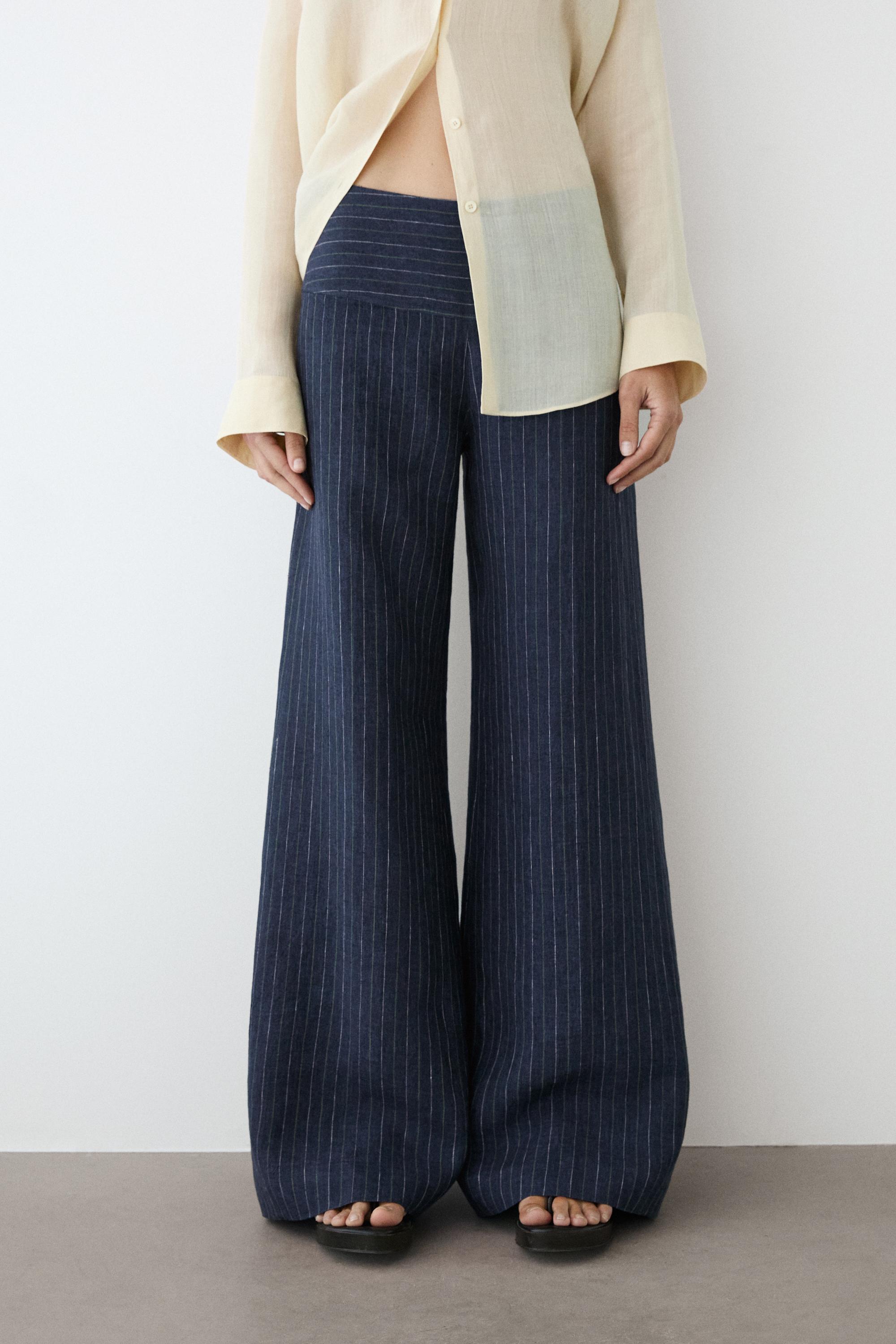 Flare fit linen trousers with striped details