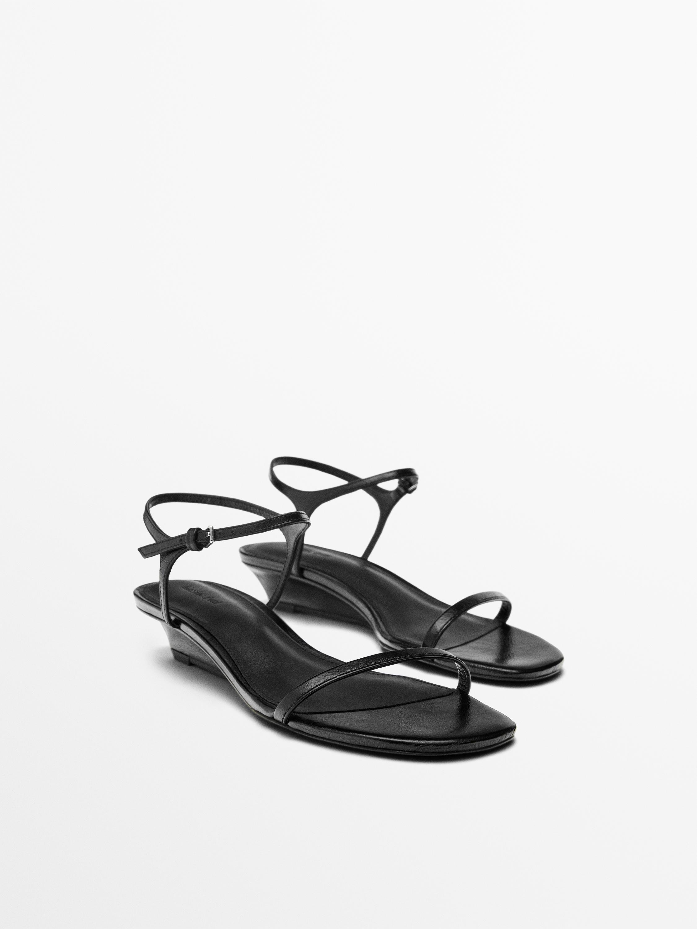 Sandale en cuir à brides compensées