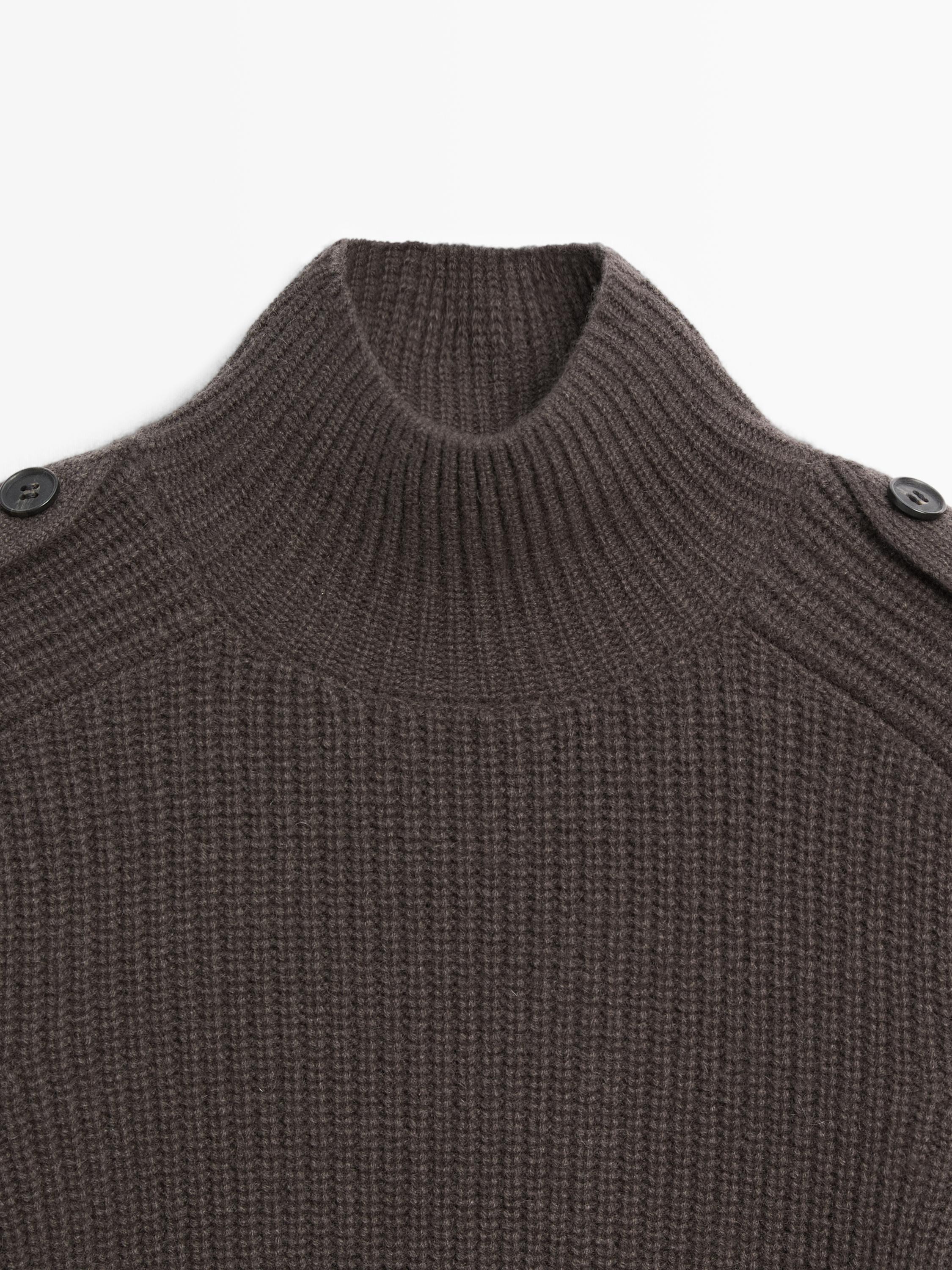 Knit sweater with shoulder detail