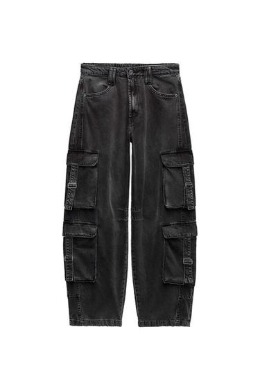 Black cargo pants with multiple pockets and a button closure, displayed on a white background.