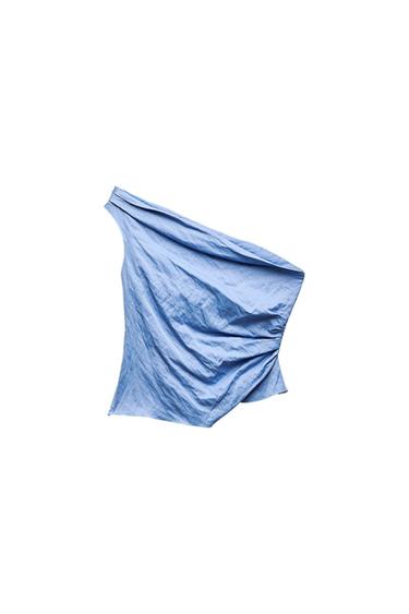 Light blue asymmetrical one-shoulder top, featuring a draped design and side ruching on a white background.