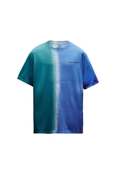Front view of a blue and green gradient t-shirt with the text 'LEAD THE GROUP' on the chest.