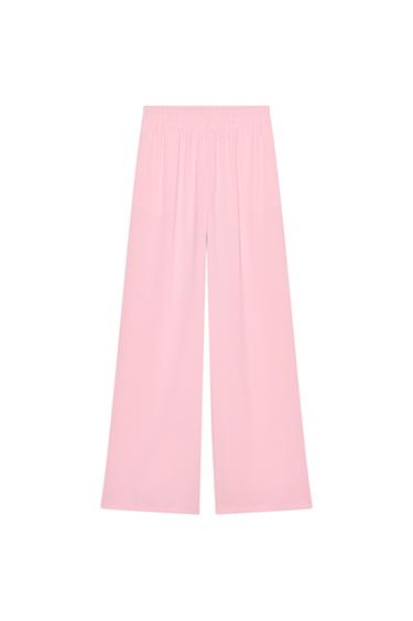 Front view of pink trousers with elasticated waistband.