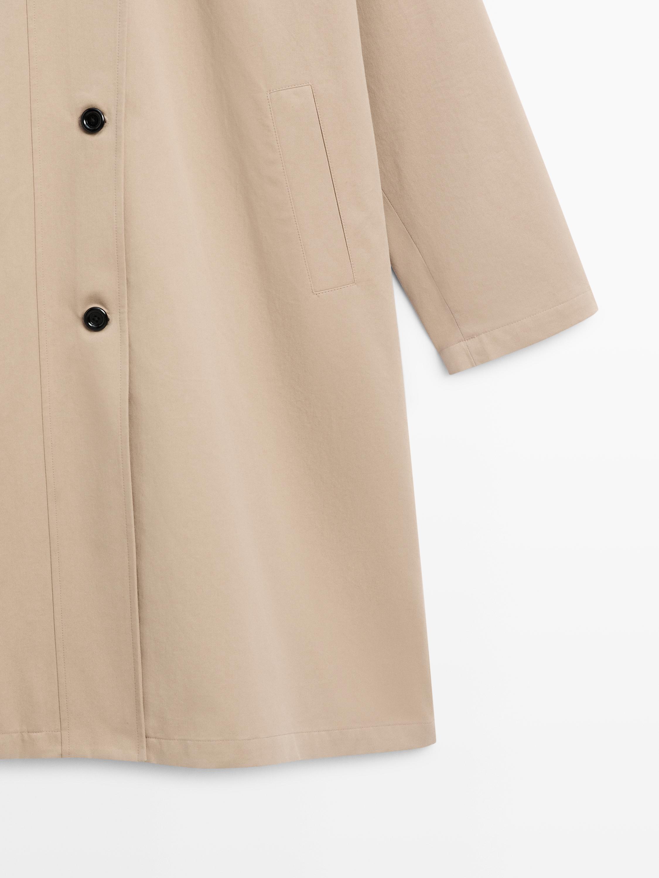 Long cotton trench coat with side fastening