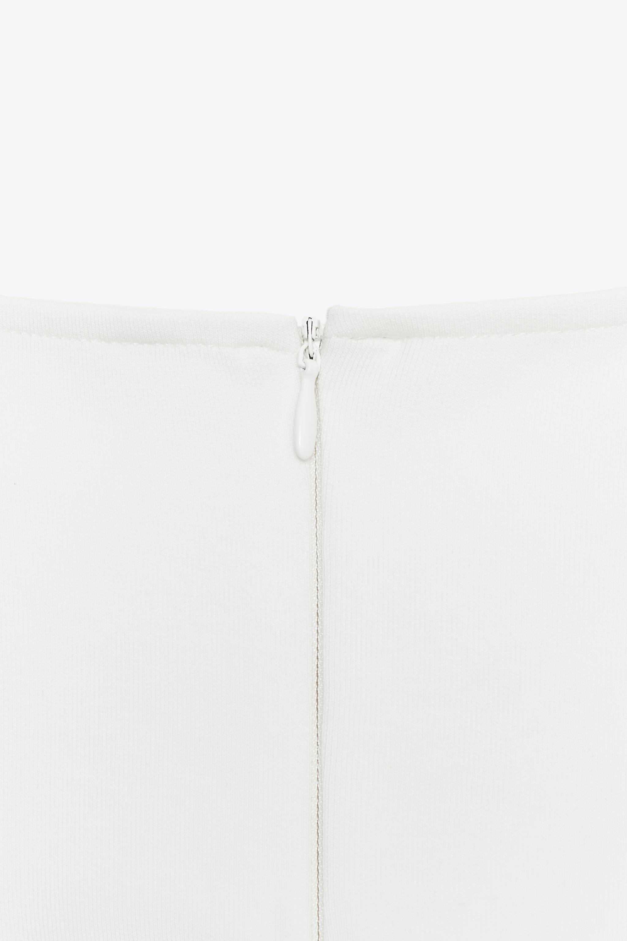 TOP INTERLOCK PÉPLUM