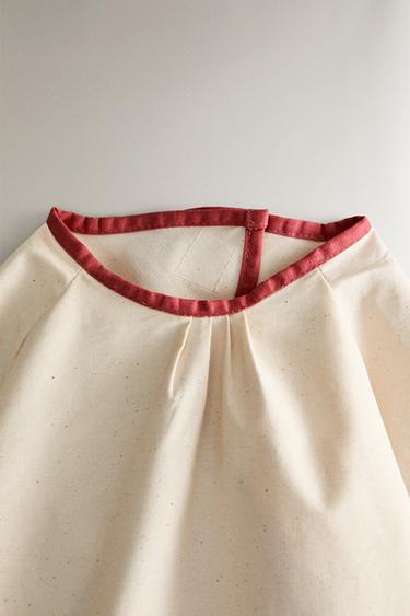 CHILDREN'S PEANUTS™ BIB WITH SLEEVES - Cream by Zara - Image 1