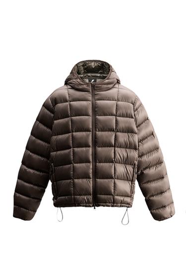 Front view of brown quilted jacket with hood and zipper closure.