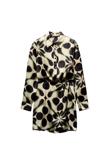 Front view of printed dress with buttons and belt.