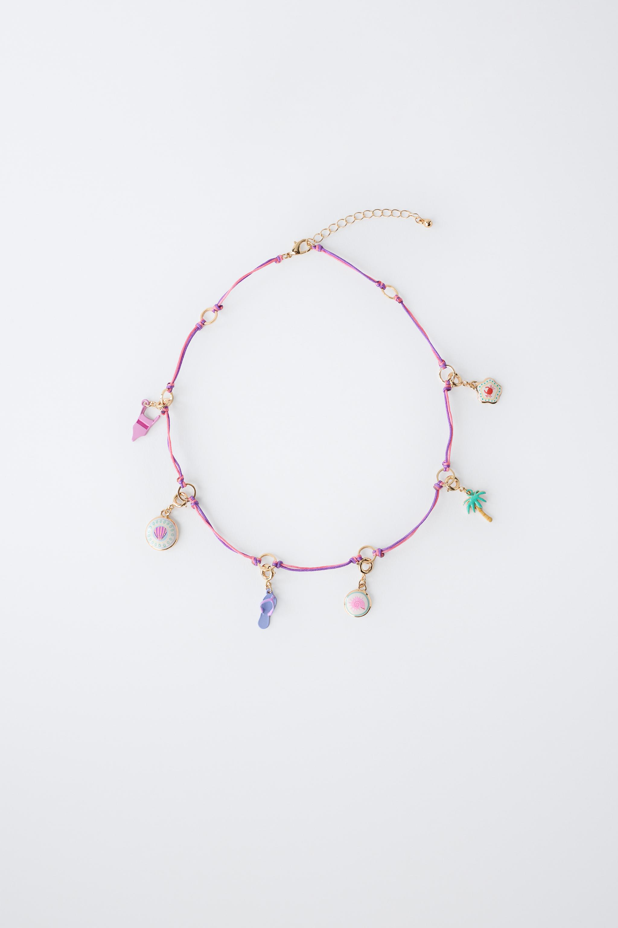INTERCHANGEABLE MULTI-CHARM NECKLACE