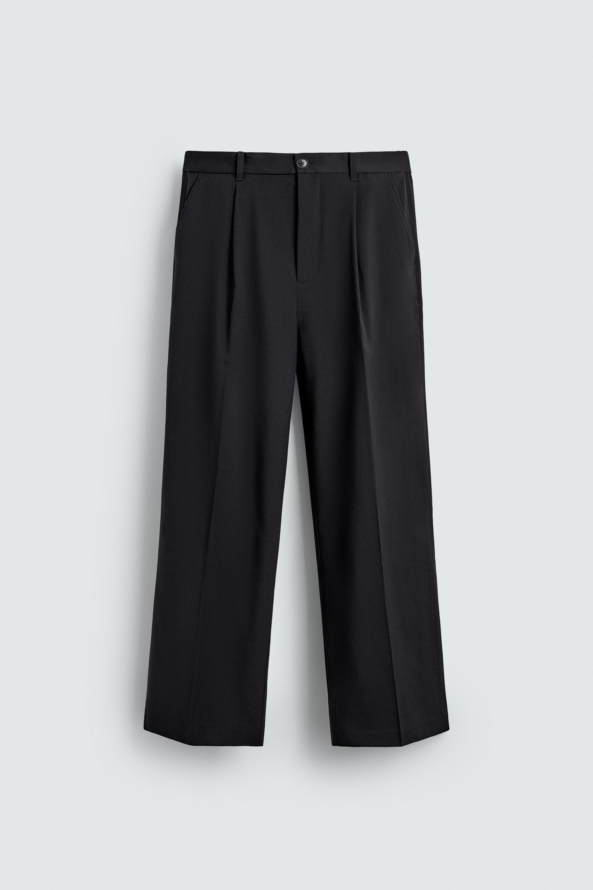 TEXTURED PLEATED PANTS