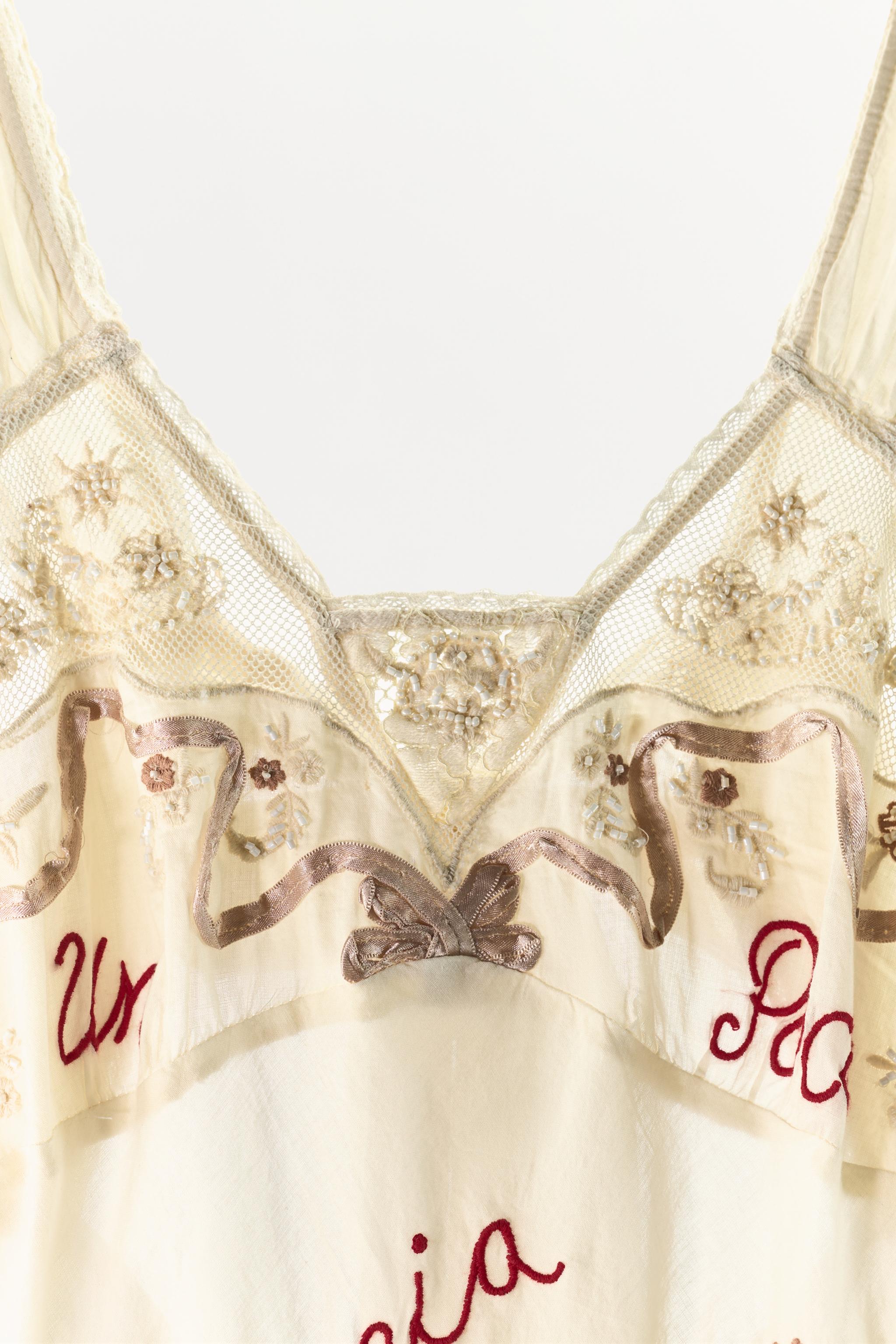 DRESS WITH EMBROIDERY, TEXT, AND BEADING