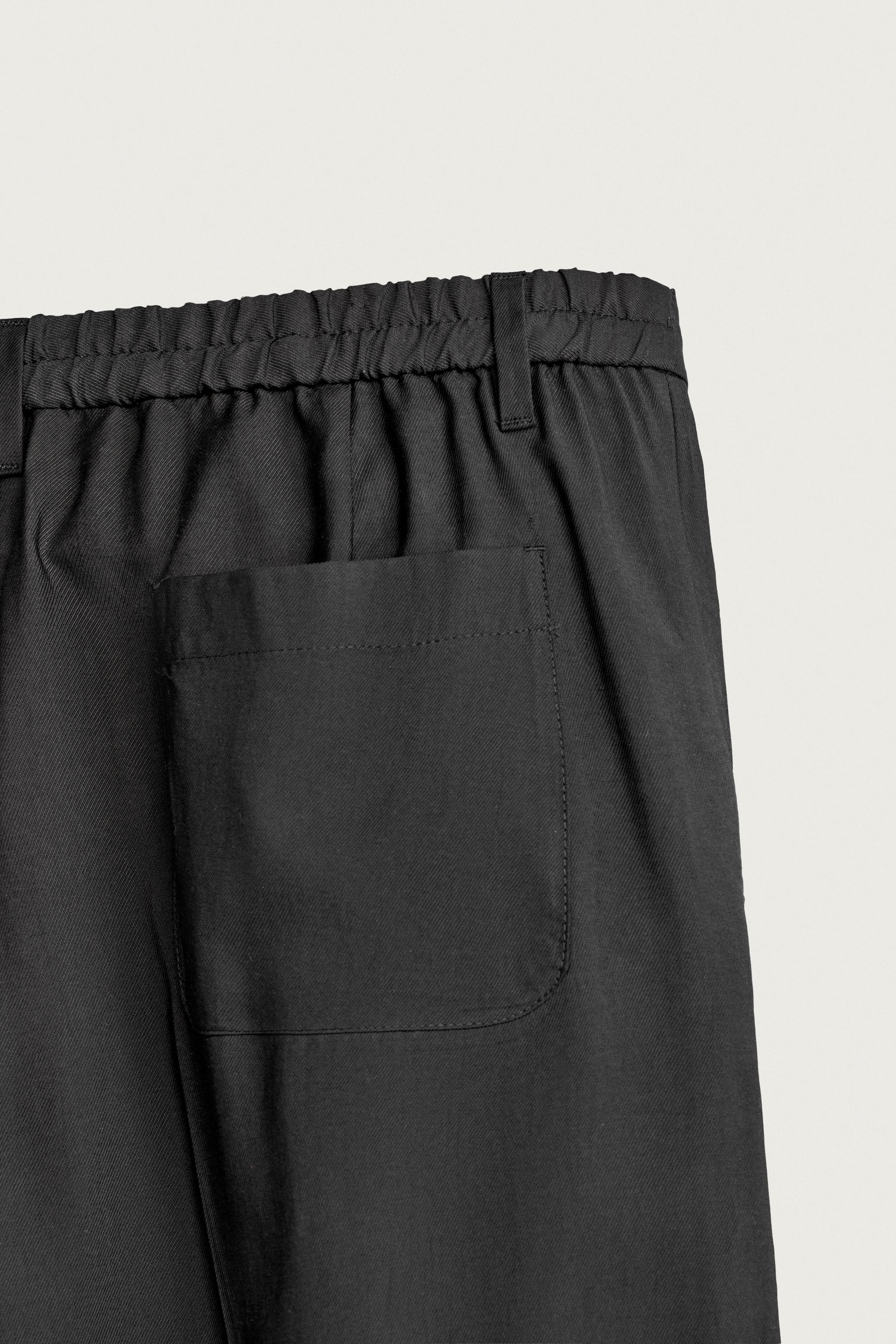 PLEATED FLOWY TROUSERS