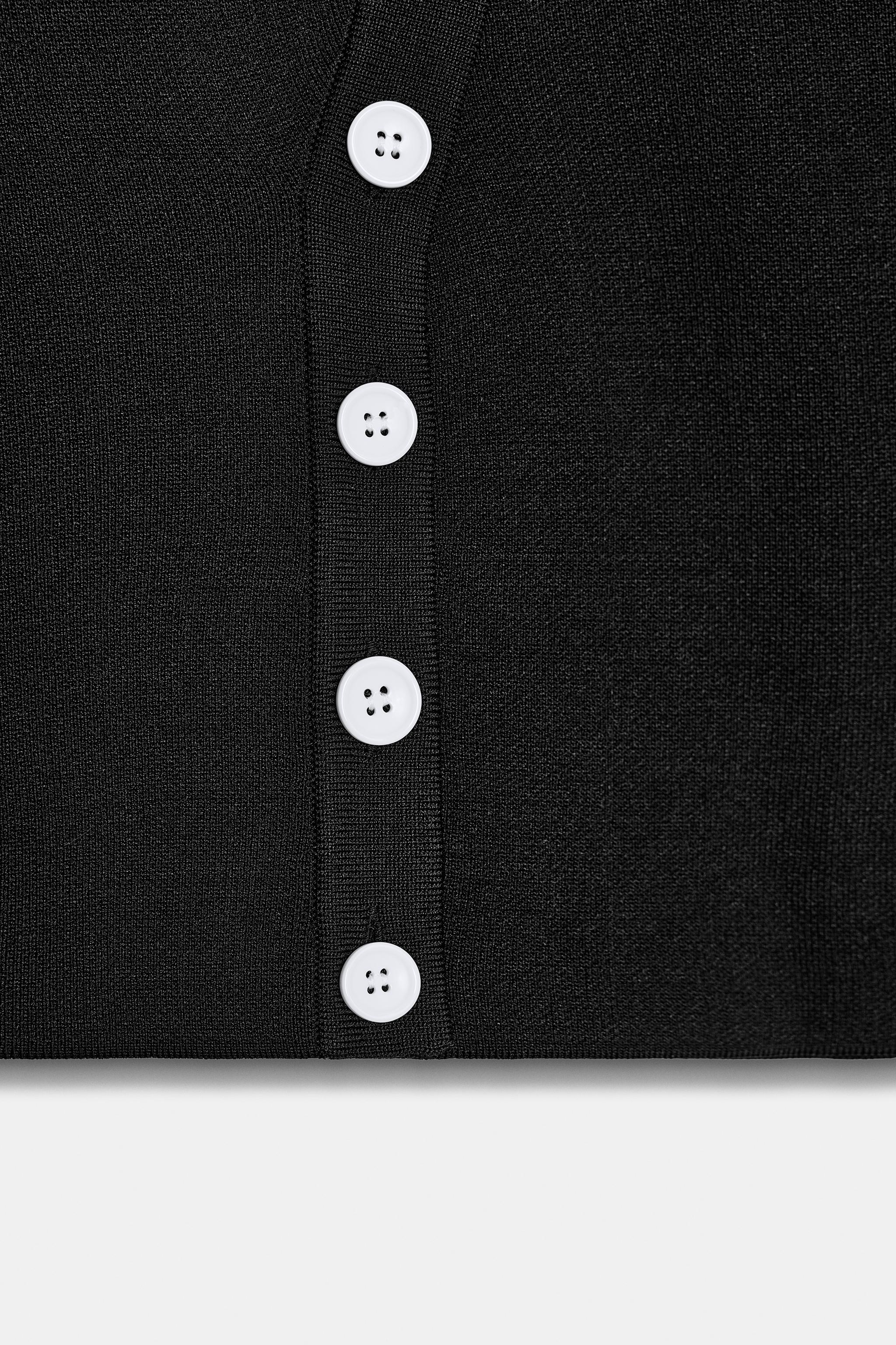 TOP EN MAILLE À FERMETURE ASYMÉTRIQUE