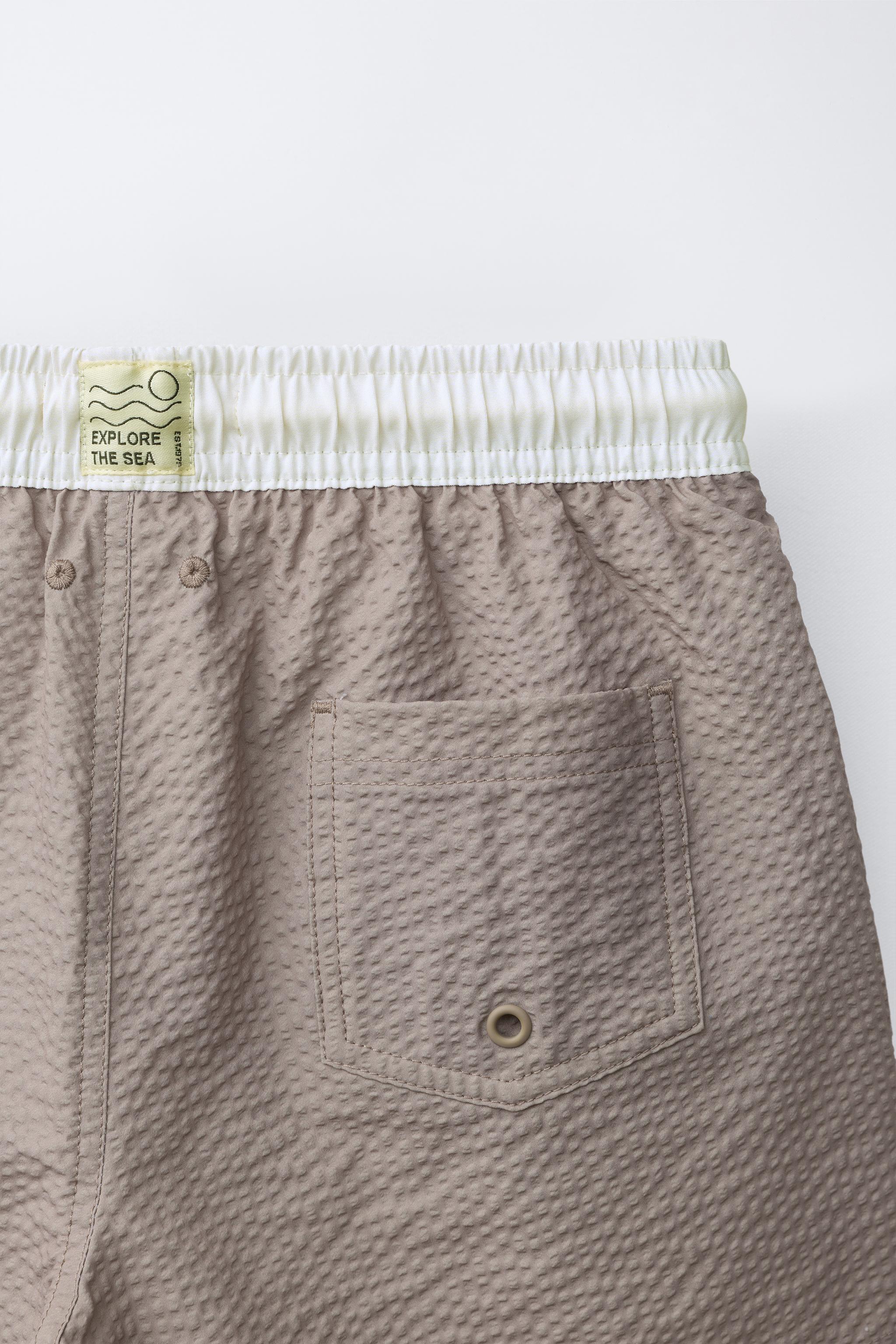 AGES 6-14 / LABEL SWIM SHORTS