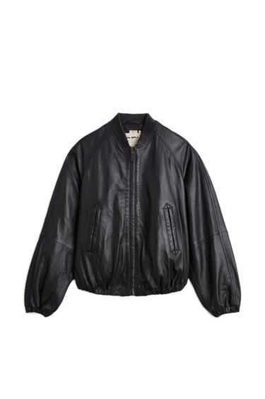 Front view of a dark plum short bomber jacket with a round neck, front zip, and side pockets.