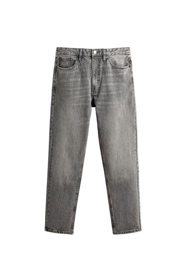 Front view of grey distressed-effect jeans with five pockets and a button and zip fastening.