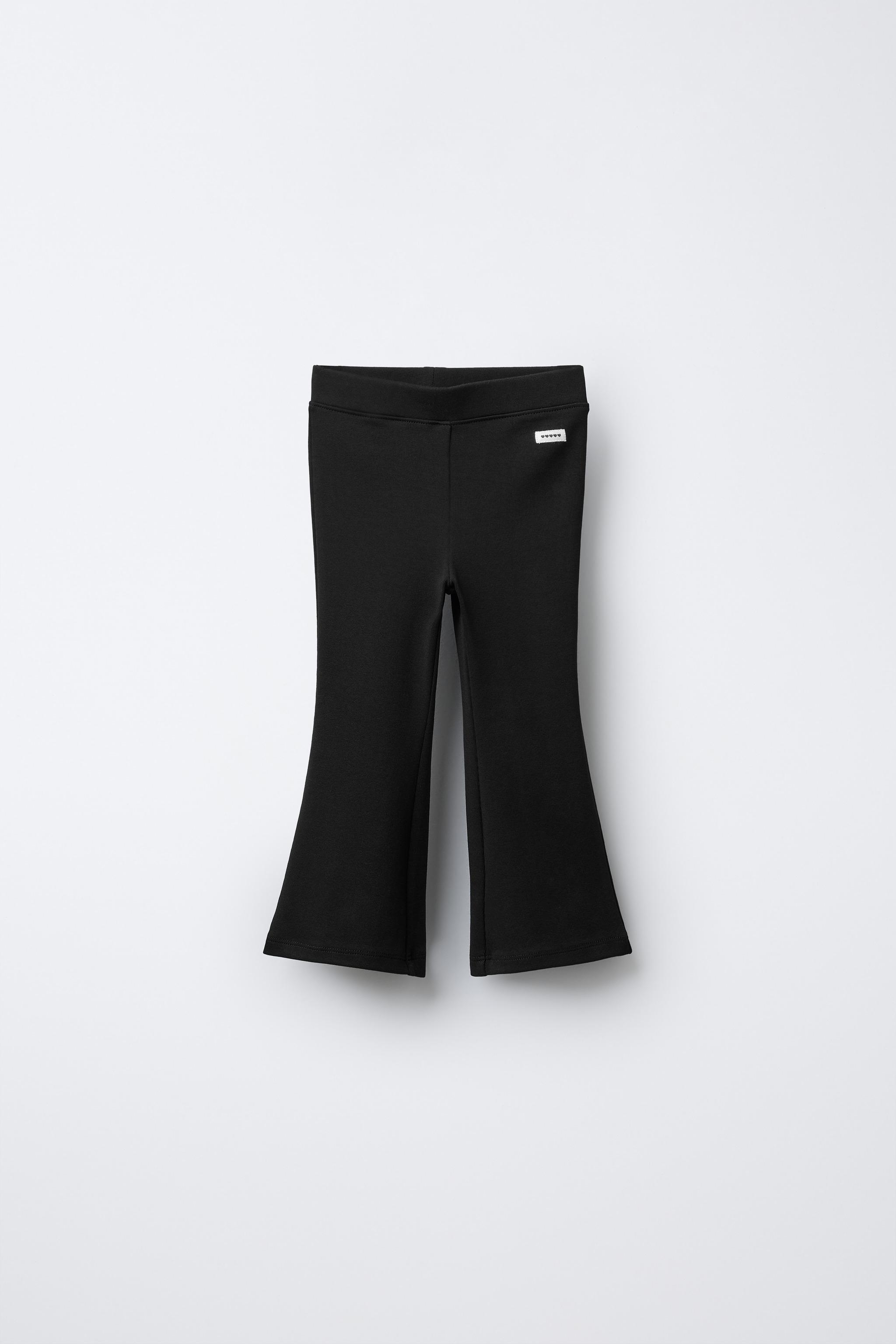 INTERLOCK FLARE LEGGINGS WITH LABEL DETAIL