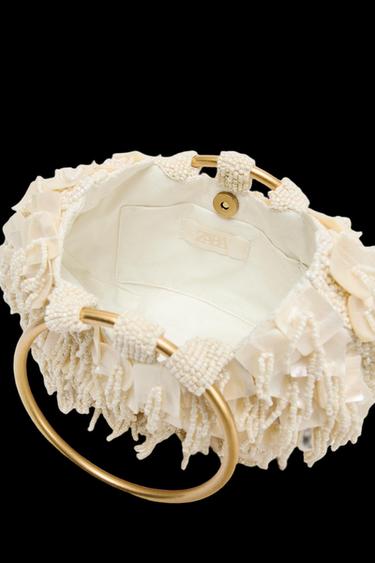 BOLSO DE MANO EFECTO NACARADO - blanco de Zara