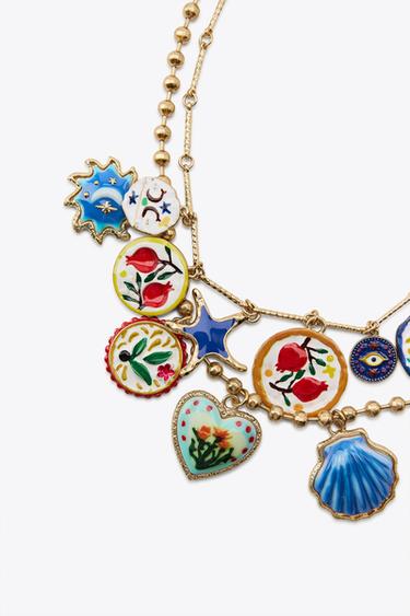 LOT DE 2 COLLIERS PALMIER FLEURS RÉSINE - Doré de Zara - Image 1