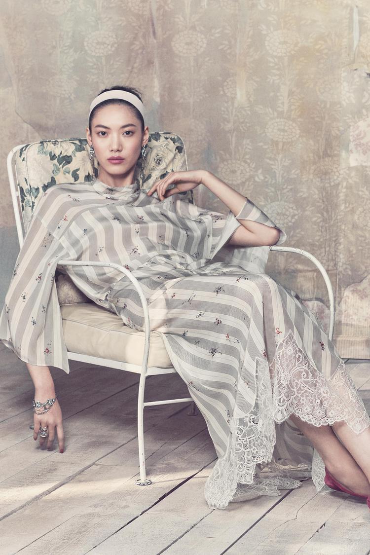 Ecru palazzo trousers and matching V-neck blouse set, with elasticated waist and side tie detail.