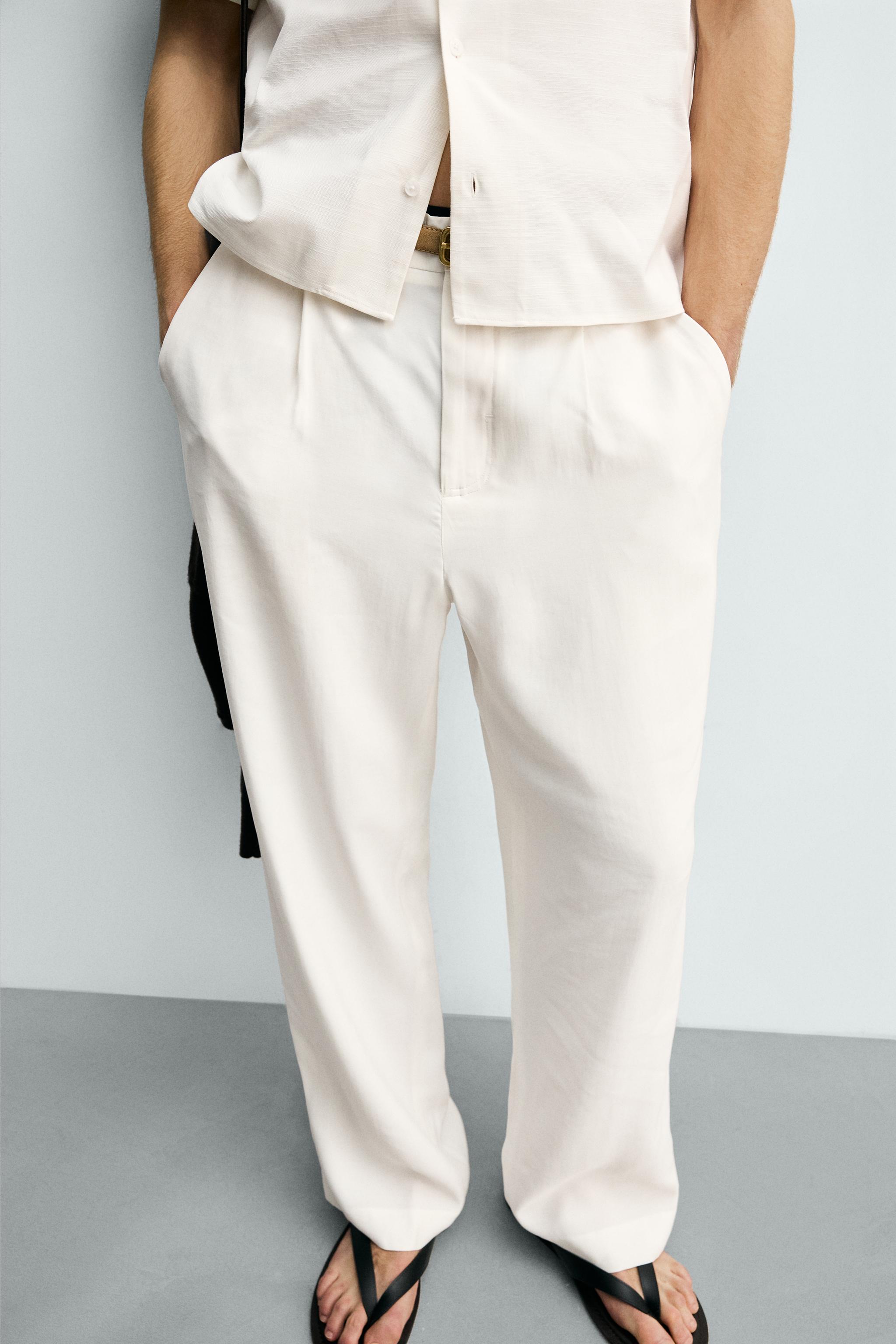 RELAXED FIT PLEATED PANTS