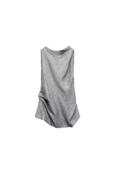 Front view of a textured grey sleeveless blouse.