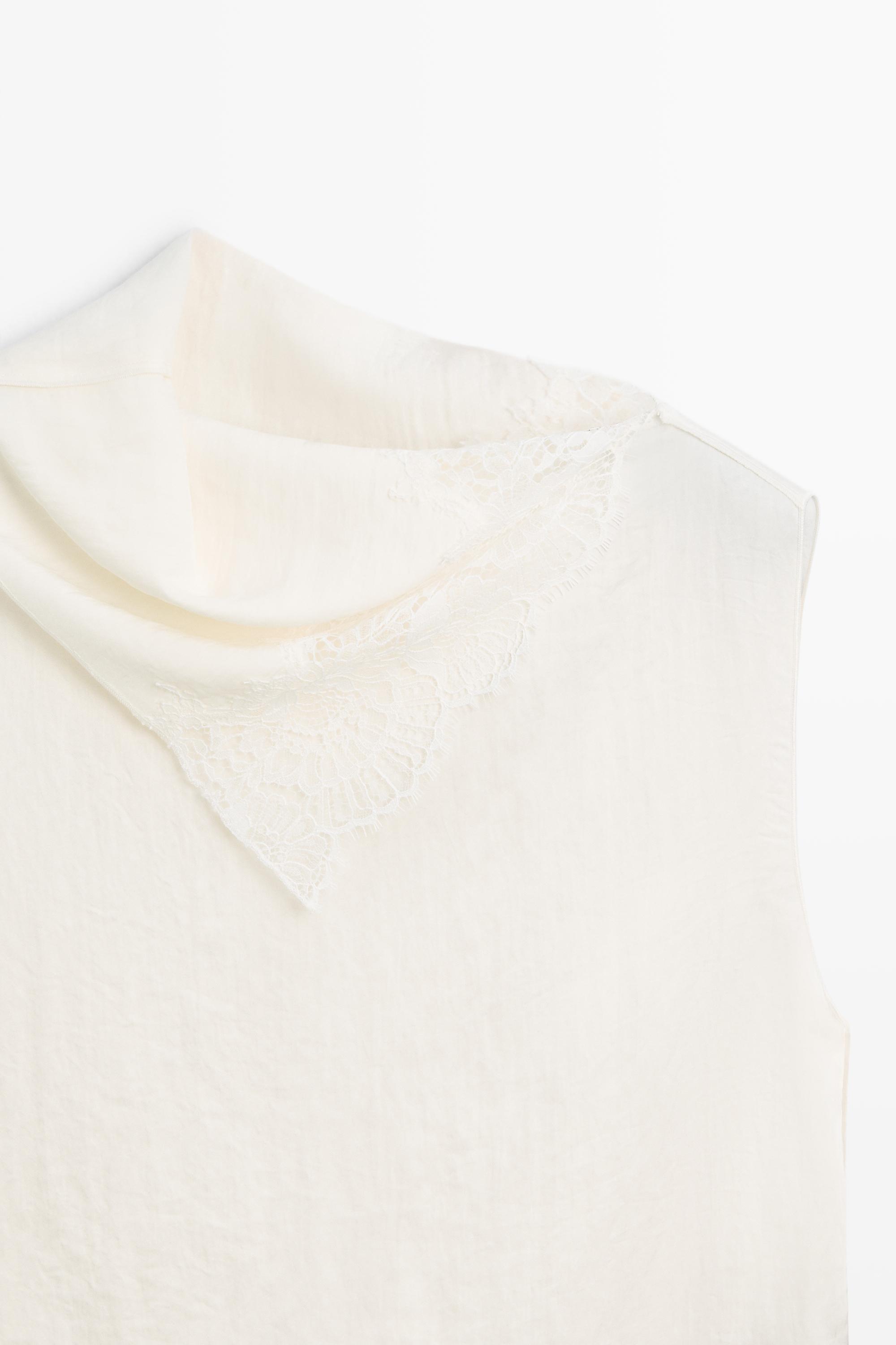 Asymmetric roll neck top with lace detail
