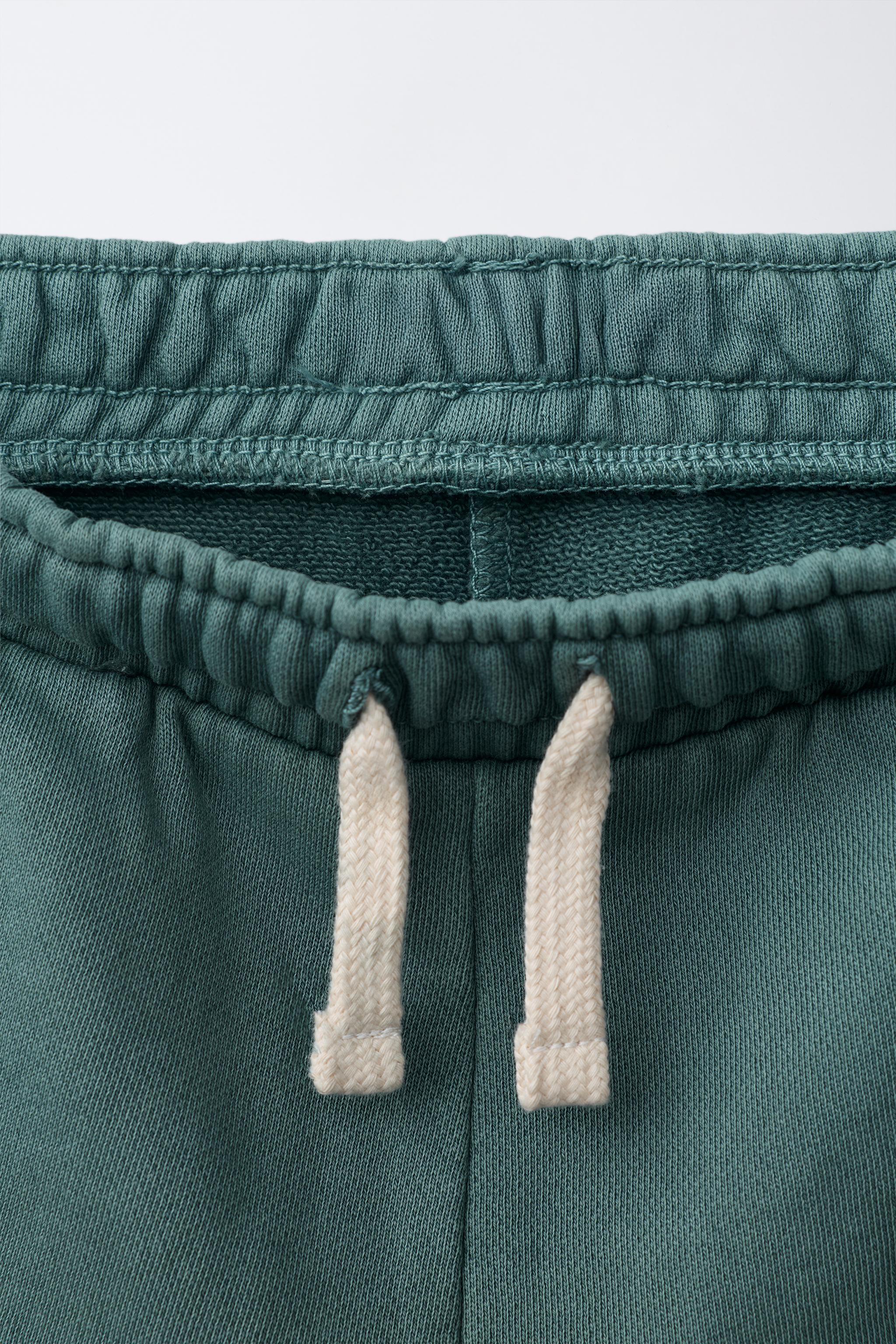 GARMENT DYED LOGO PLUSH SHORTS