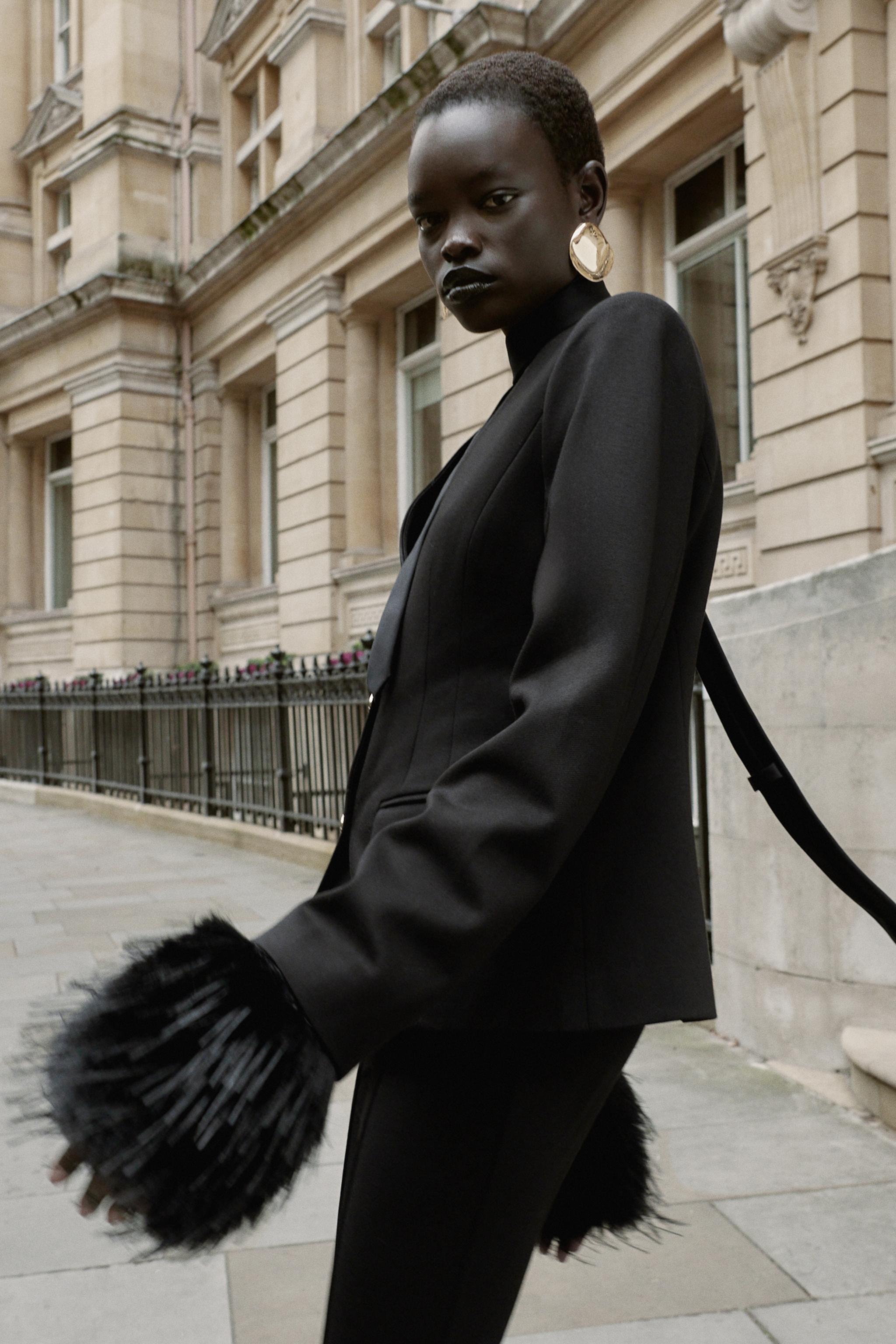 VESTE COURTE À ÉPAULETTES