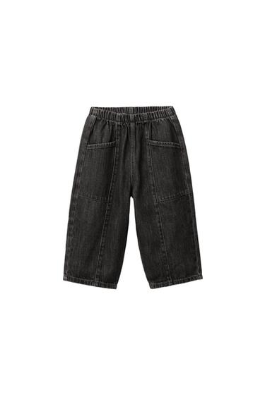 Front view of grey balloon-fit jeans with an elasticated waistband and front patch pockets.