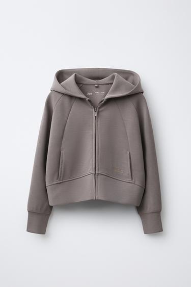 JACKE MIT REISSVERSCHLUSS, SCHRIFTZUG UND MODAL - Braun / Braungrau von Zara - Bild 0