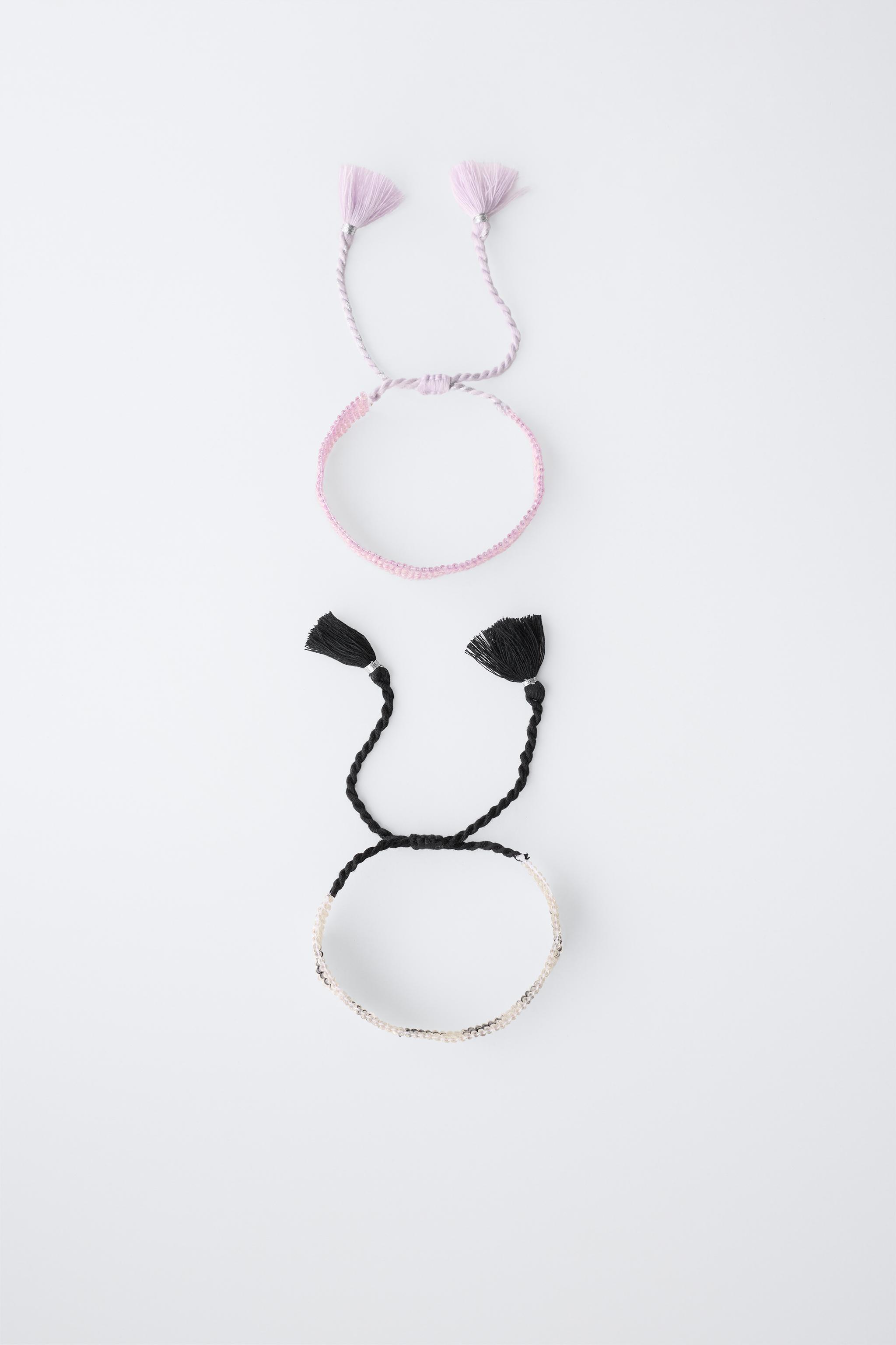 LOT DE DEUX BRACELETS AVEC FANTAISIE ÉTOILE
