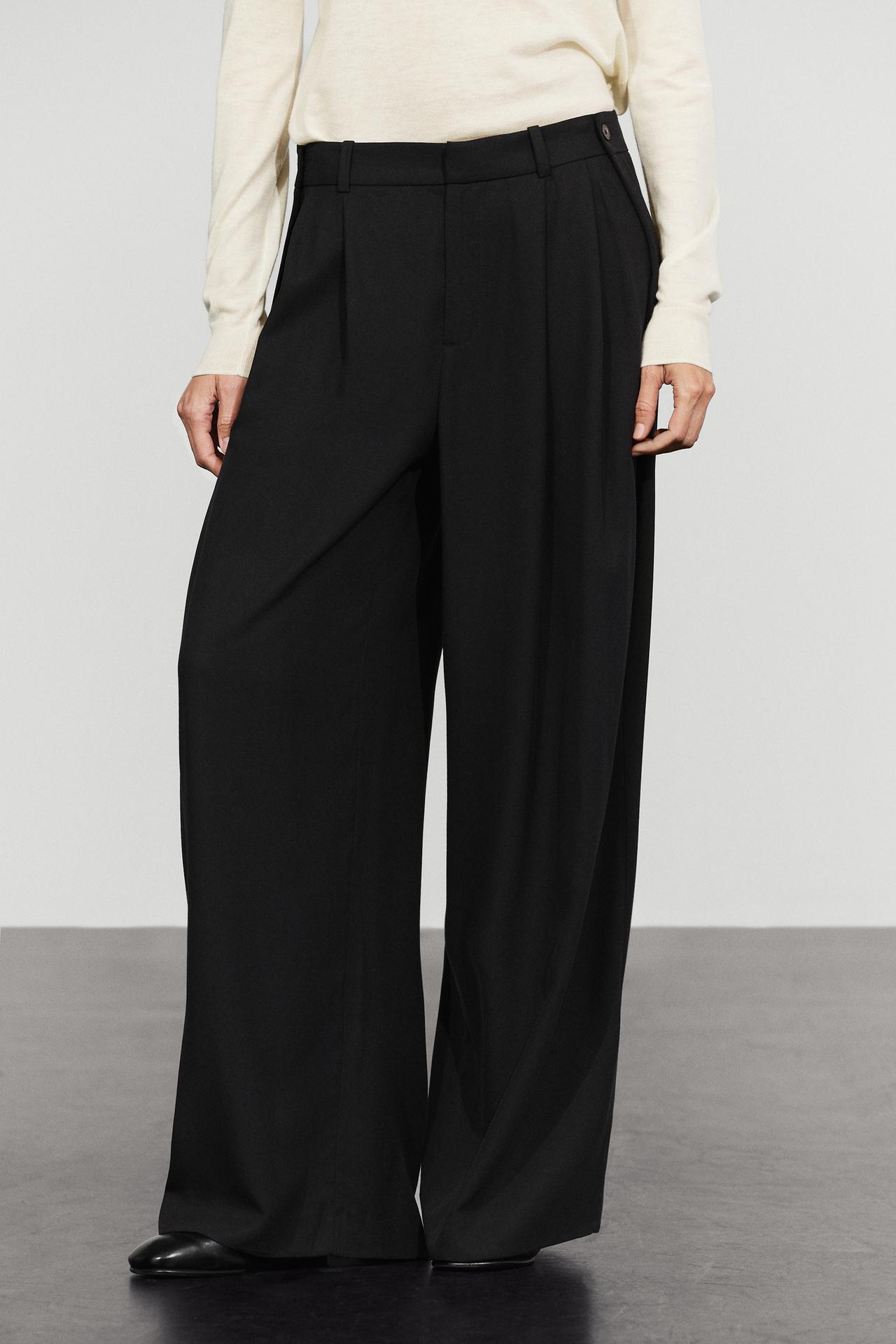 Flowing pleated pants with button detail — Black