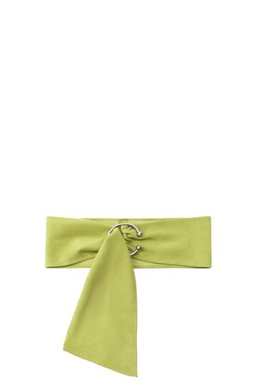 Light green wide belt with a silver-tone metal ring detail in the centre and a hanging fabric strap, on a white background.