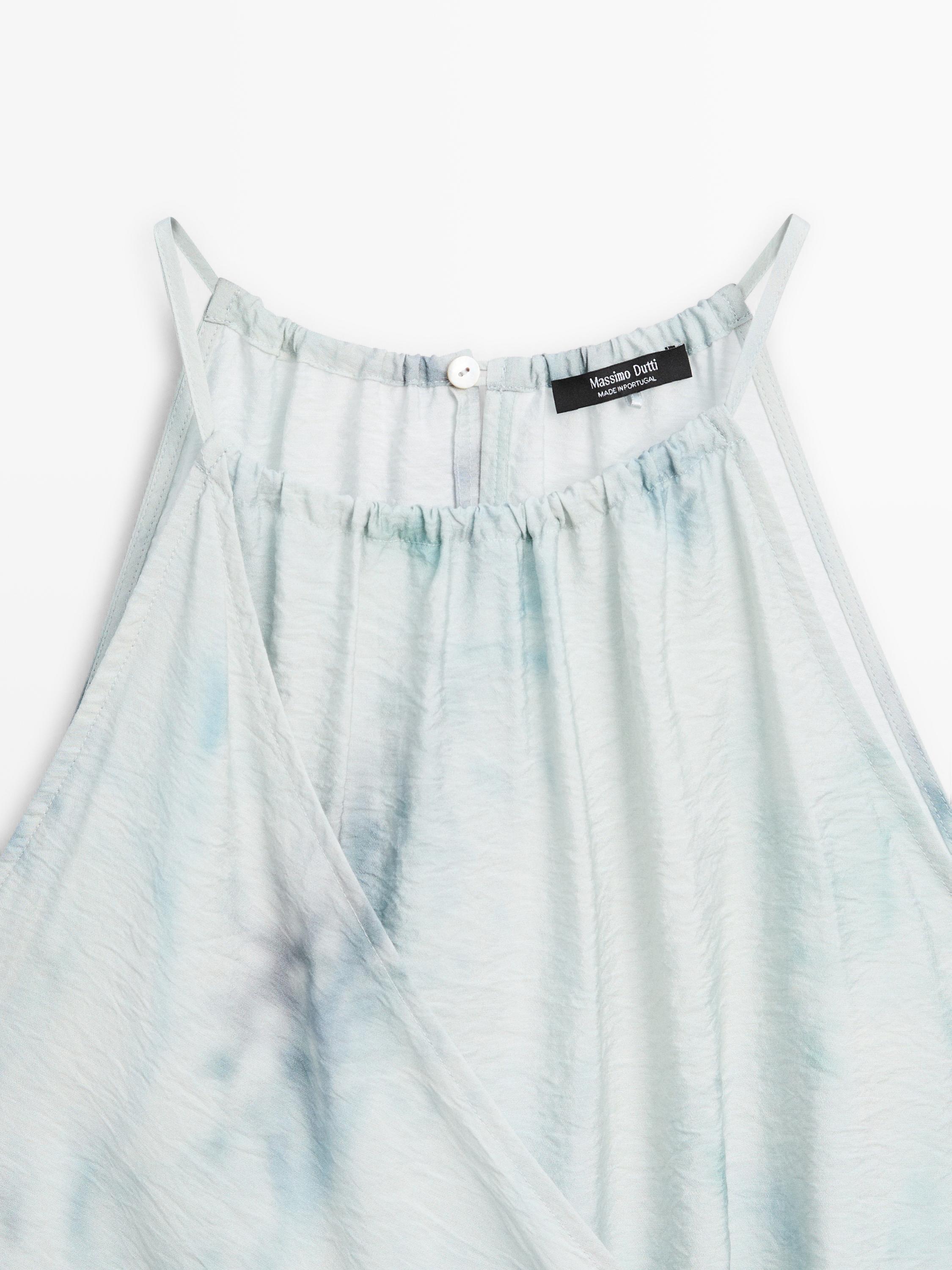 Flowing halterneck top with tie detail