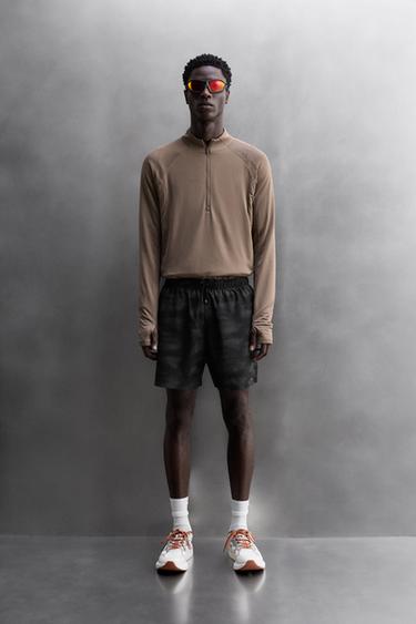 PANTALONES CORTOS PERFORADOS RUNNING - Negro de Zara