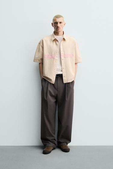SOBRECAMISA BOXY FIT TEXTO PARCHES - Crudo de Zara - Imagen 0