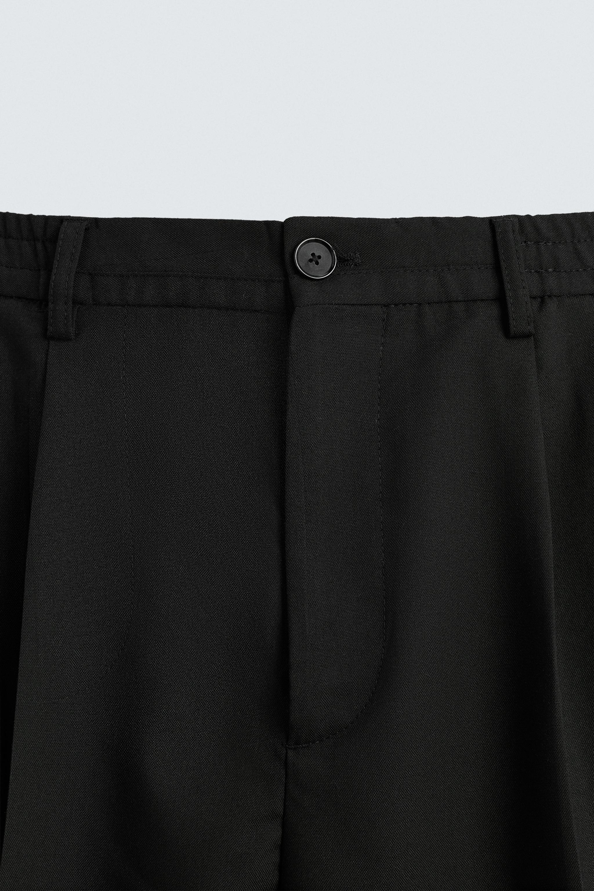 FLOWY PLEATED WIDE FIT PANTS